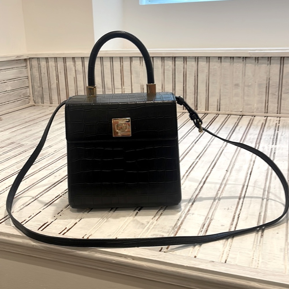 Black Sparrows Weave top handle bag with crossbody strap.